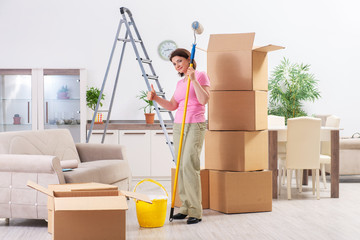 Middle-aged woman doing renovation at home 