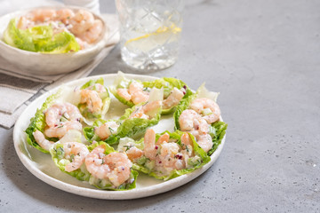 Shrimp salad wraps in lettuce leaves on a holiday table