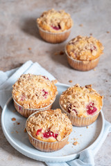 Fresh homemade delicious raspberry muffins on a table
