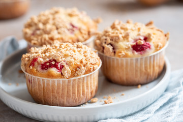 Fresh homemade delicious raspberry muffins on a table