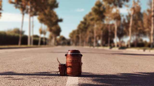 brown container on concrete road