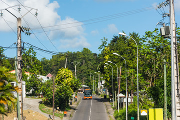 Bus on a narrow street in Guadeloupe