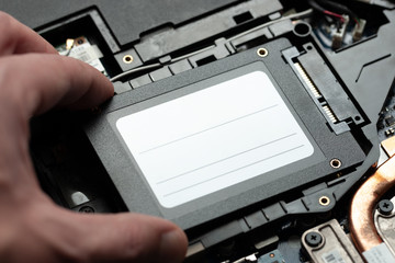 installing new solid-state drive to laptop pc. sata and power connection close up.upgrade laptop...