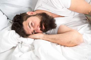 Sleep disorders concept. What a long night. Man bearded hipster having problem with sleep. Guy...