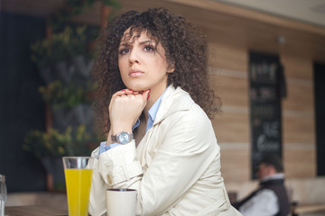 Young businesswoman having a coffee break at caffe 