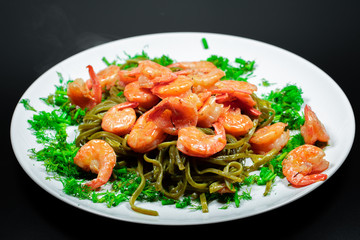 Shrimps with pasta and herbs. Home cooking.