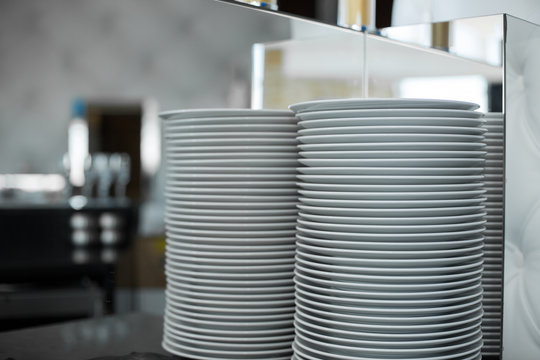 Stack Of Clean White Plates In A Restaurant. Event Prepare Details