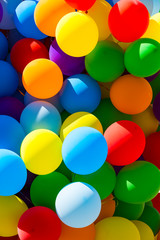 Background of a set of colored balloons on the sky background 