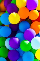 Background of a set of colored balloons on the sky background 