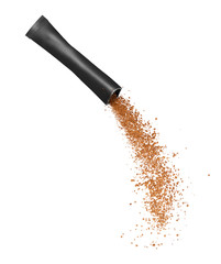 Freeze dried instant coffee pours from the packaging on a white background.