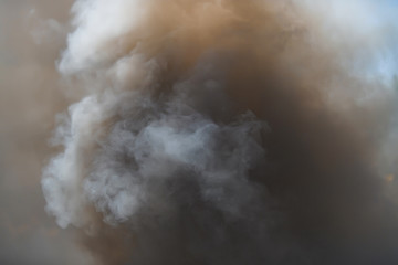 Pyrotechnic means for start-up smoke. Hand smoke grenade. Smoke bomb black. Gray smoke. The texture...
