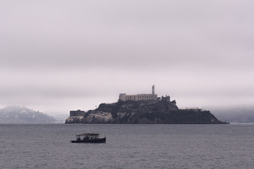 Morning fog clears around Alcatraz Island in San Francisco