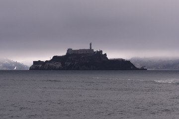 Morning fog clears around Alcatraz Island in San Francisco