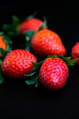 strawberries on black background