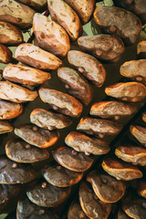 Hanging Italian Dry-cured Ham Prosciutto In Shop. Italian Cuisine