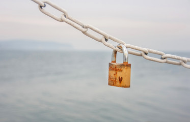 Lock as a love symbol against the sea