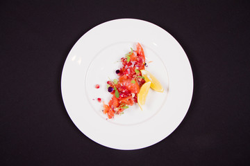 Salmon with pomegranates and onion appetizer