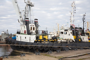 Marine tugboats moored in the port.