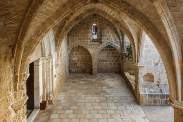 Fototapeta na wymiar Abbey of Bellapais in the Northern Cyprus. Bellapais Abbey is the ruin of a monastery built by Canons Regular in the 13th century near the Kyrenia (Girne).
