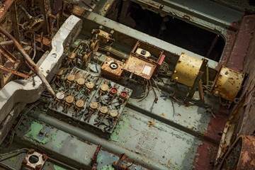 Internal parts of decommissioned marine ship that was cut and left on the shore.