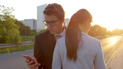 CLOSE UP: Man is annoyed with woman after bumping into her on the sidewalk.