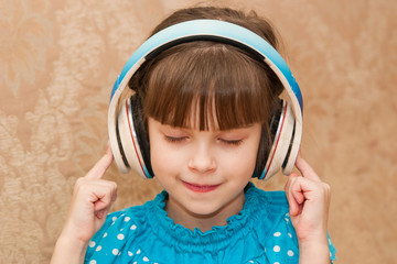 Girl in headphones listening to music