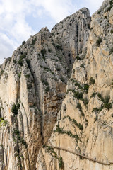 Caminito del rey hike and valley. Mountain path along steep cliffs and an enormous heights.