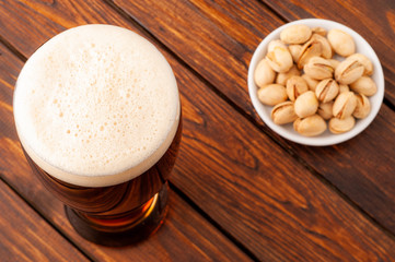 glass of dark cold frothy beer