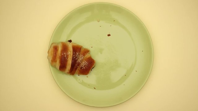 Croissants on yellow background - Stop motion video