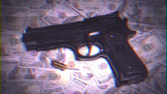 Intentional noise distortion fx tv transmission: a gun and a bullet over a floor of US Dollar banknotes.