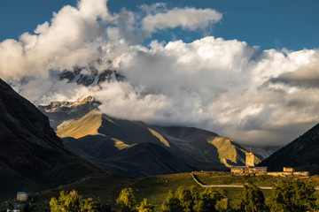Mountain Shkhara sunset landscape with beautiful clouds and dramatic light.