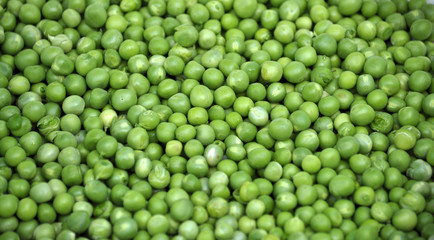 A grain of peeled young green peas
