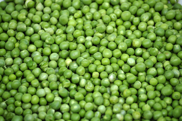 Fototapeta na wymiar A grain of peeled young green peas