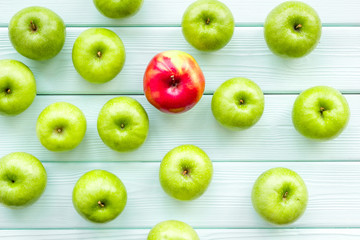 green apples for organic summer food pattern on light wooden background top view