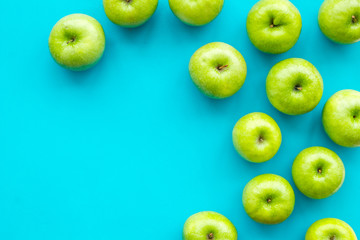 summer fruit pattern with apples on blue colorful background top view copyspace