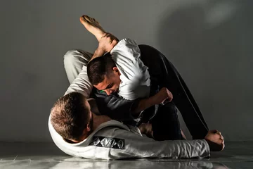 Fotobehang Brazilian Jiu Jitsu BJJ training sparring fight triangle submission © Miljan Živković