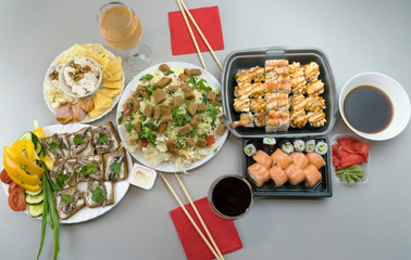 A wonderful romantic dinner for two with Japanese rolls and glasses of red wine and white wine