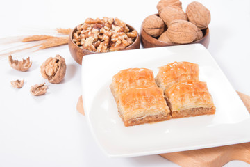 traditional turkish walnut baklava on white plate ready to eat