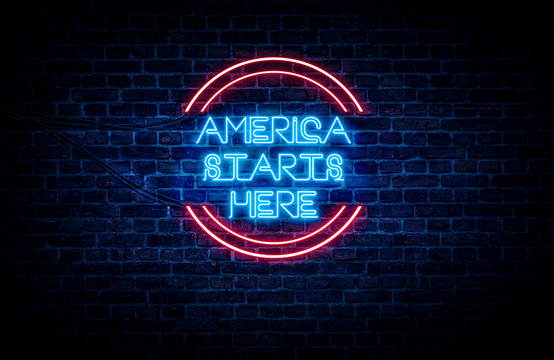 A sign showing Pennsylvania state slogan, in blue and red neon light on a brick wall background and wires on the side.