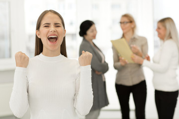 Happy businesswoman working at the office