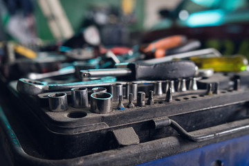 Close up on the tools at the mechanics workshop socket keys