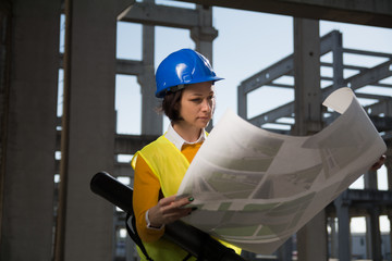 Confident female engineer analyzes project