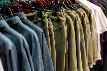 Obraz premium colorful clothes hanging on store racks