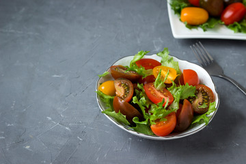 Fresh appetizer of lettuce and tomato.