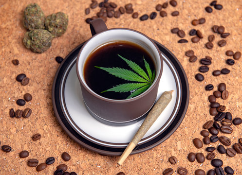 Cannabis coffee cup with marijuana leaf, joint, nugs and coffee beans