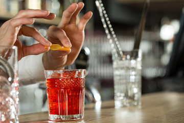 Almost done. Horizontal shot of making an amazing drink.