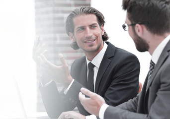 two clerks sitting at their Desk.