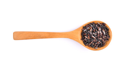 Rice berry in a wooden spoon on a white background.