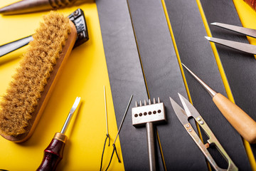 Leather workplace. Hand craft or leather working. Materials, accessories and working tools on...