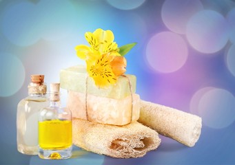 Aromatic Perfume bottles on wooden table on blurred background